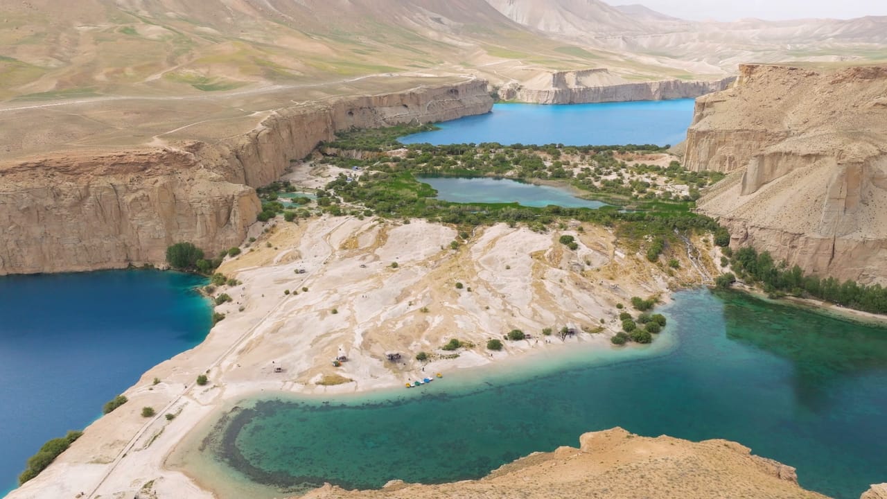 Aerial view of the blue lakes of Band-e Amir between pale travertine shores and limestone cliffs in Bamyan, Afghanistan